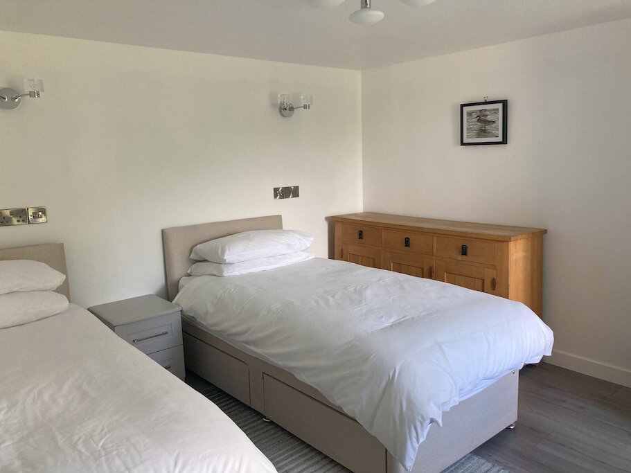 One of the bedrooms in the main house