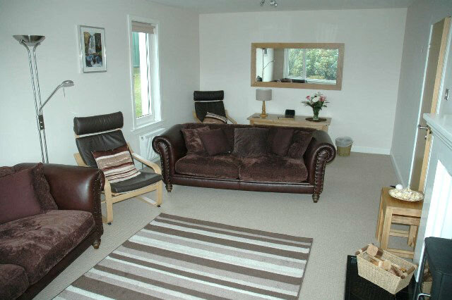 Spacious livingroom with quality solid oak furnishings Spacious livingroom with quality solid oak furnishings