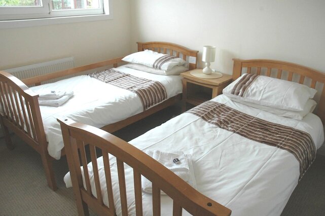 Twin bedroom with solid wood beds Twin bedroom with solid wood beds